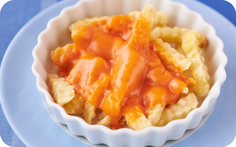写真:明治ベジフルスライスのアレンジレシピ「フライドポテトのベジフルスライスのせ」